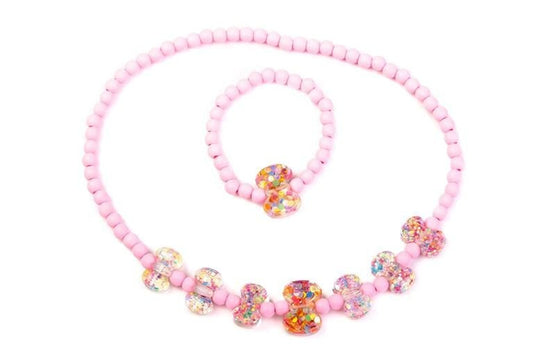 Set de collar y pulsera de bolitas de plástico rosa y lacitos de brillantina